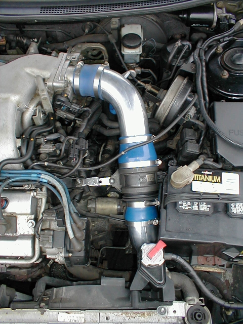 New cold air intake mounted. Here you can see what I did with the extra bracket that came with the CAI kit. I folded it up in a Z shape and bolted it to the stock VAF for extra stability.