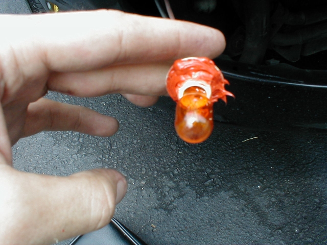 With a generous layer of RTV sealant, I try to get a little better of a seal on the fog light housing.